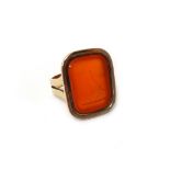 A gold and cornelian intaglio signet style ring, crest seal engraved between split shoulders,