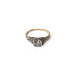 A gold and platinum, diamond set ring,