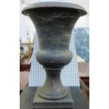 A large modern marble campana urn, raised on a square foot (a.f), 76cm high.