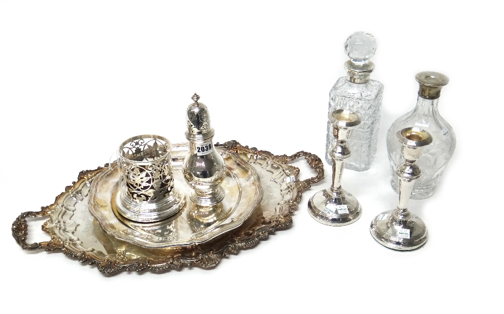 A silver sugar caster, of baluster form, London 1931, weight 292 gms,