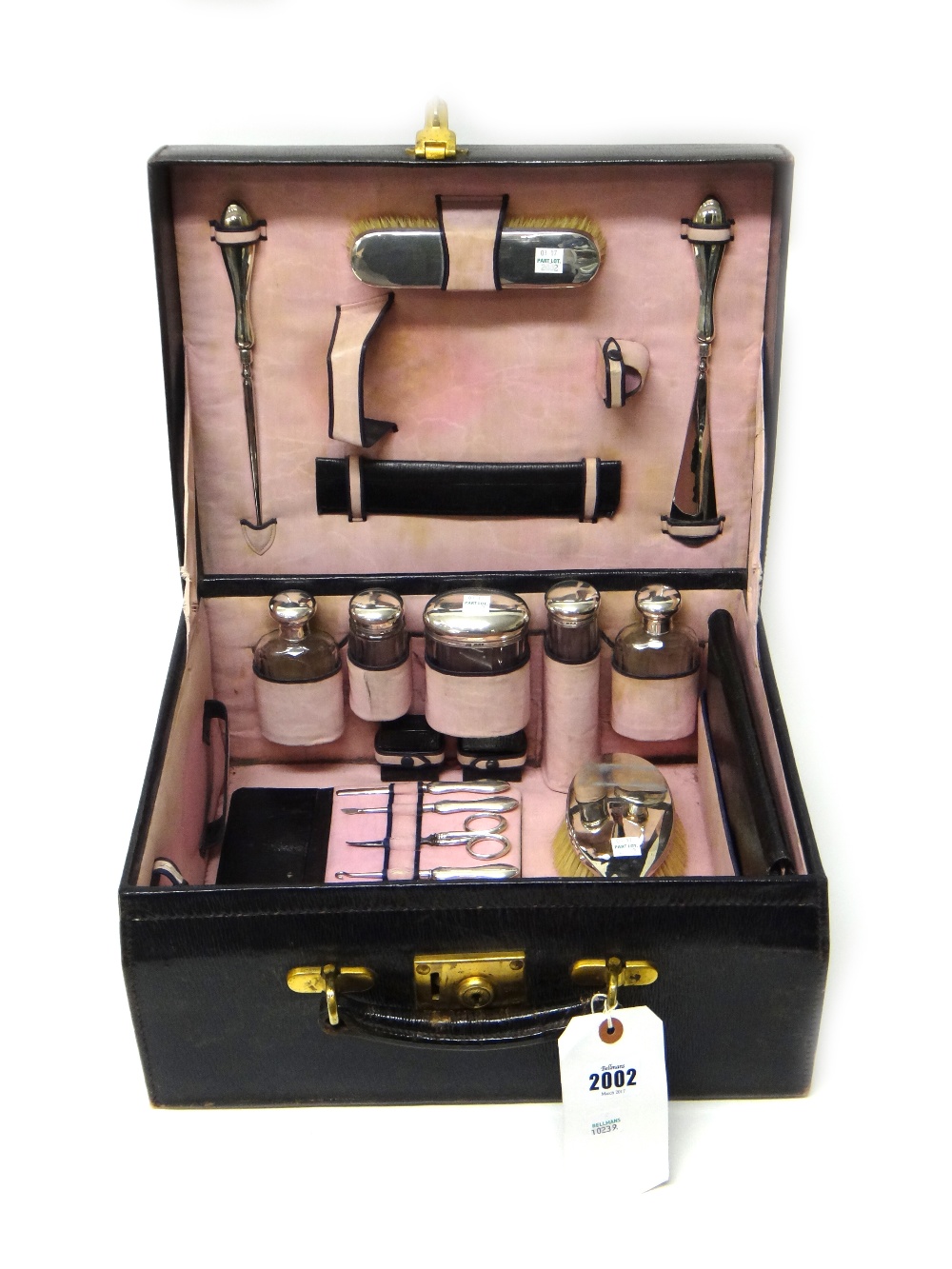 A lady's silver mounted travelling toilet set, including a hand mirror, a hairbrush,