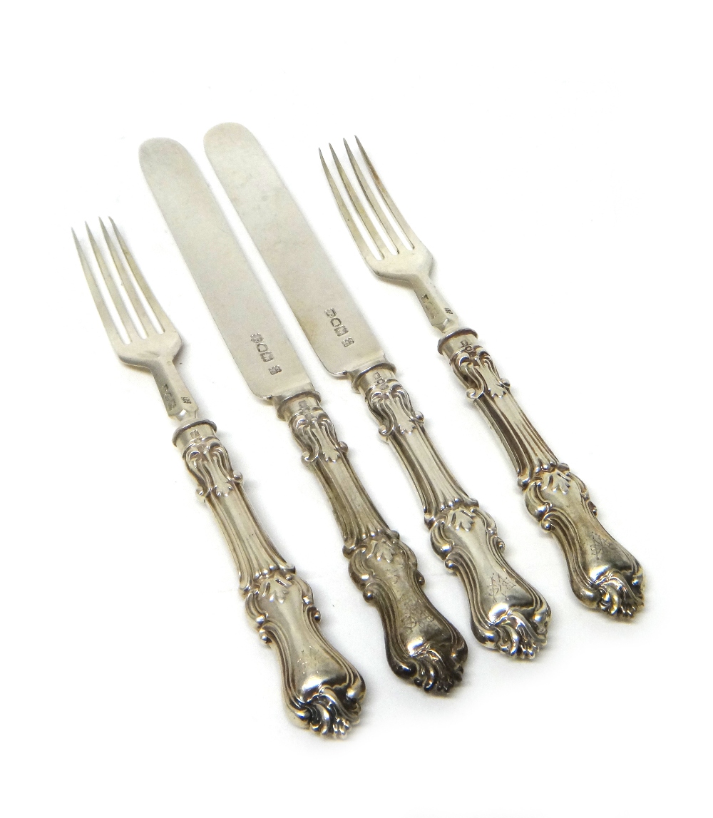 A silver part set of dessert or fruit knives and forks,