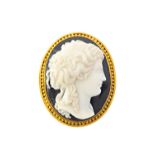 A gold mounted oval carved banded agate cameo brooch, carved as the portrait of a classical lady,