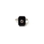 A diamond and black onyx ring,