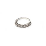 A white gold and diamond nine stone half hoop eternity ring,