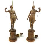 A pair of carved beechwood figures of Venus, late 18th century, later adapted to lamps,