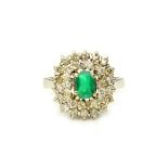 A white gold, emerald and diamond cluster ring,