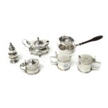 Silver and silver mounted wares, comprising; a tea strainer, fitted with a wooden handle,