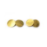 A pair of gold cufflinks, the circular backs and fronts with engine turned decoration,