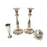 A pair of plated table candlesticks,