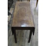 A George III mahogany drop leaf dining table, on square chamfered legs, 101cm wide, leaves reduced.