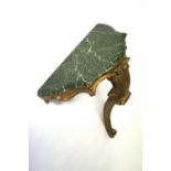 A Florentine giltwood wall bracket, second half 20th century, with painted faux marble top,