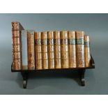 An Edwardian mahogany boxwood strung and chequer banded table top book rack,