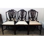 A matched set of six Hepplewhite style mahogany dining chairs, with arched pierced splat backs,