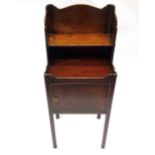 A reproduction George III style mahogany pot cupboard, with raised shelved back,