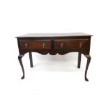 A mid 18th century style oak dresser, incorporating earlier elements,