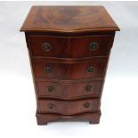 A reproduction mahogany serpentine fronted chest of four drawers, 46cm wide.