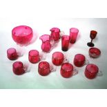 A collection of Victorian cranberry glasswares, including 8 custard cups, 2 cream jugs, 2 bowls,