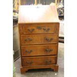 A lady's reproduction yewwood bureau, with four drawers below, 50.5cm wide.