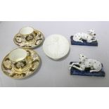 A pair of early 19th century English porcelain coffee cans and saucers,