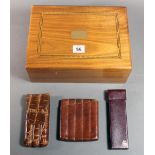 A contemporary walnut humidor cigar box, the hinged cover with inlaid banding,