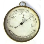 A brass drum case barometer/thermometer, circa 1900, 12cm diameter.