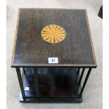 An Edwardian mahogany satinwood crossbanded square table top revolving bookcase,