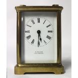 A brass cased carriage timepiece, the white enamel dial signed, 'E Tanish Weston Super Mare',