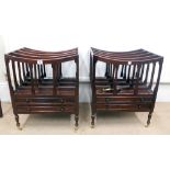 A pair of reproduction Regency style mahogany four division Canterburys each with two drawers below,