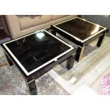 A pair of 20th century ebonised square low tables on block supports, 76cm wide.