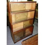 A 20th century oak modular bookcase with sliding glass doors, 89cm wide x 137cm high.