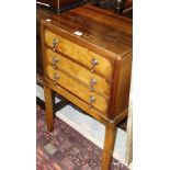 A 20th century oak drop flap two tier table,