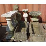 Garden statuary to include a reconstituted stone lion, four white stone pillars,