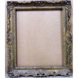 An early 20th century gilt plaster swept frame, aperture 75cm x 63cm.