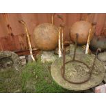 Garden statuary; two white metal table bases, pair of terracotta ball finials,