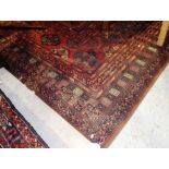 A large machine made carpet of Turkman design, 408cm long.