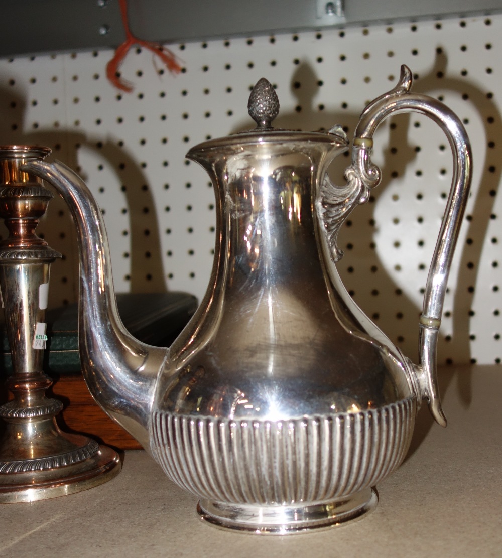 A large quantity of mixed silver plated items to include; flatware, two pairs of candlesticks,