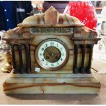 A late 19th century French onyx and gilt metal mounted mantel clock of architectural form with