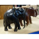 A quantity of assorted African souvenir carved elephants including a pair of ebony bookends, (qty).