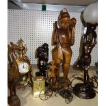 A group of collectables including carved wooden figures, two gilt metal clocks and sundry,