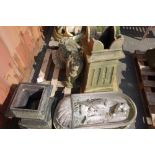 A group of garden statuary to include terracotta chimney pot, stone planters,