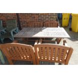 A rectangular teak garden table, together with four open armchairs, (5).
