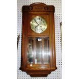A 20th century walnut cased eight day wall clock.