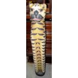 A painted hardwood model of a tiger.