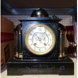 An early 20th century slate cased eight day mantel clock.