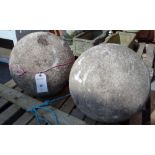 A pair of reconstituted stone spherical ball finials, (2).
