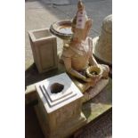 A reconstituted stone figure of Buddha, a stone bird bath and sundry.