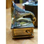 A Europa brass cased oval travelling alarm clock,