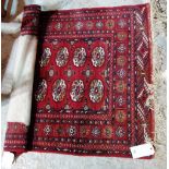 An Indian Bokhara rug, with two columns of ten guls, 167cm x 97cm.