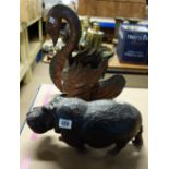 An African carved hardwood figure of a hippo and a copper jardiniere in the form of a swan, (2).